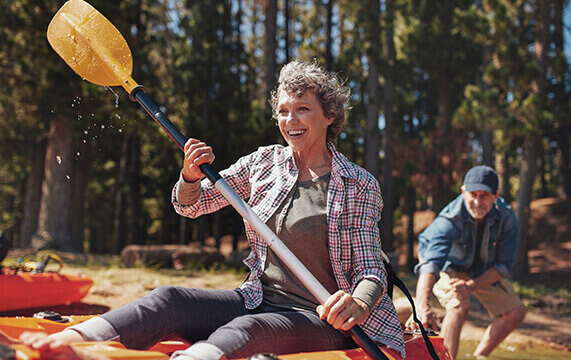 senior couple kayaking together