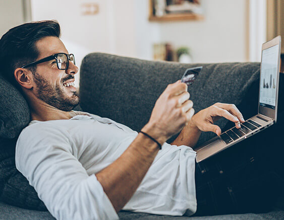 man paying bills online