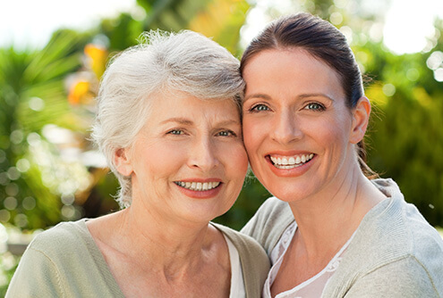 smiling mother and daughter