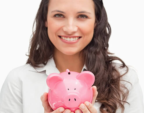 smiling woman holding a piggybank