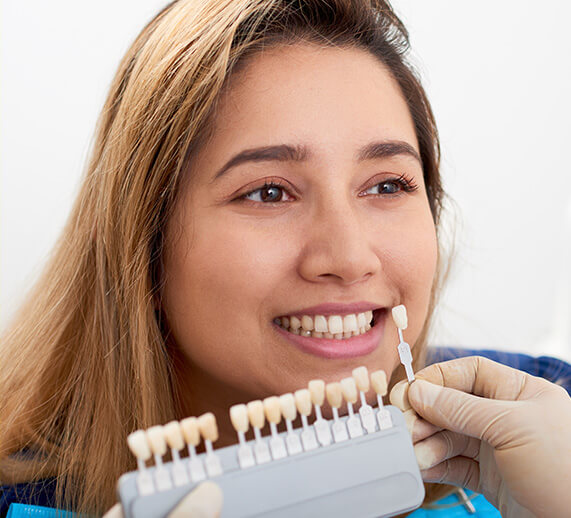 dental patient having veneers matched to her teeth