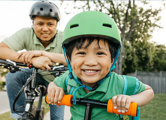 boy smiling on bike