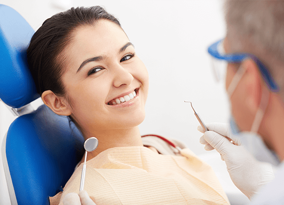 woman smiling at the dentist